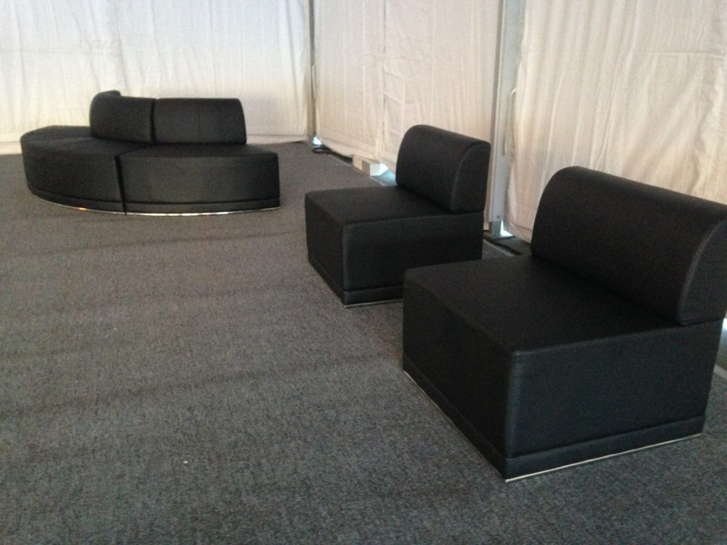 Black leather furniture with pewter carpet