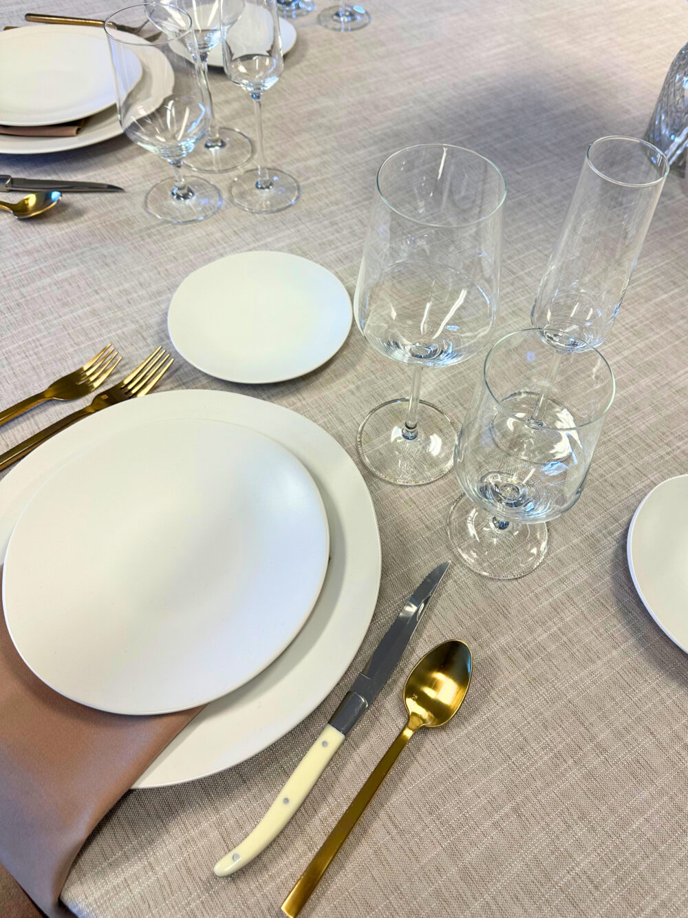 a table with plates and glasses