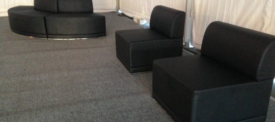 Black leather furniture with pewter carpet