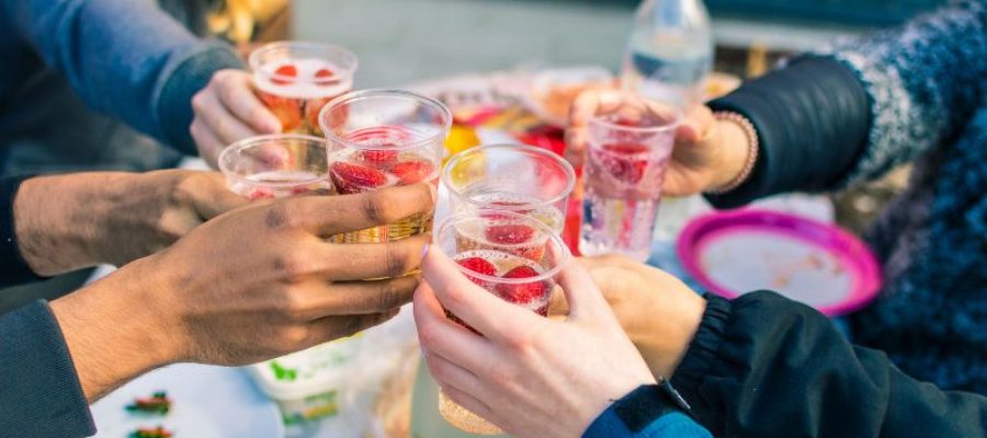 Crowd raising glasses to make a toast